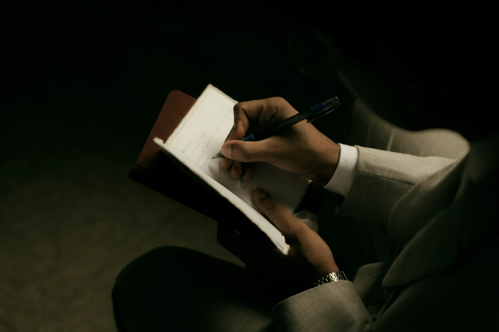 Notebook writing in warm window light
